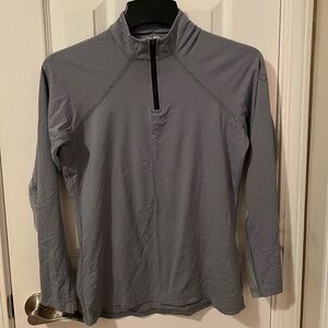 Pastel green Quarter-Zip riding shirt.